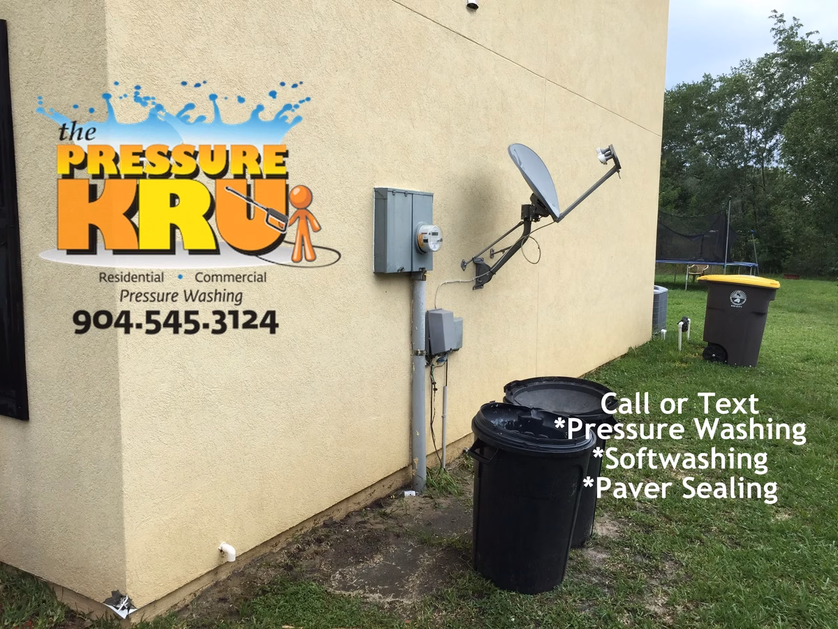 Soft washing a stucco home to remove mold and mildew in St. Johns Golf and Country Club after.