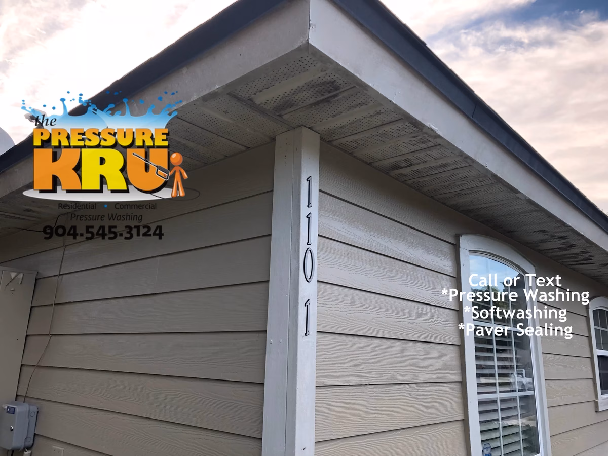close-up image showing a soft wash exterior cleaning in Julington Creek neighborhood removing mold.