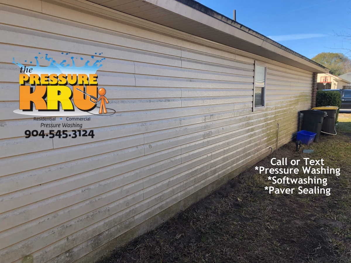 Exterior vinyl siding before house washing in Julington Creek neighborhood.