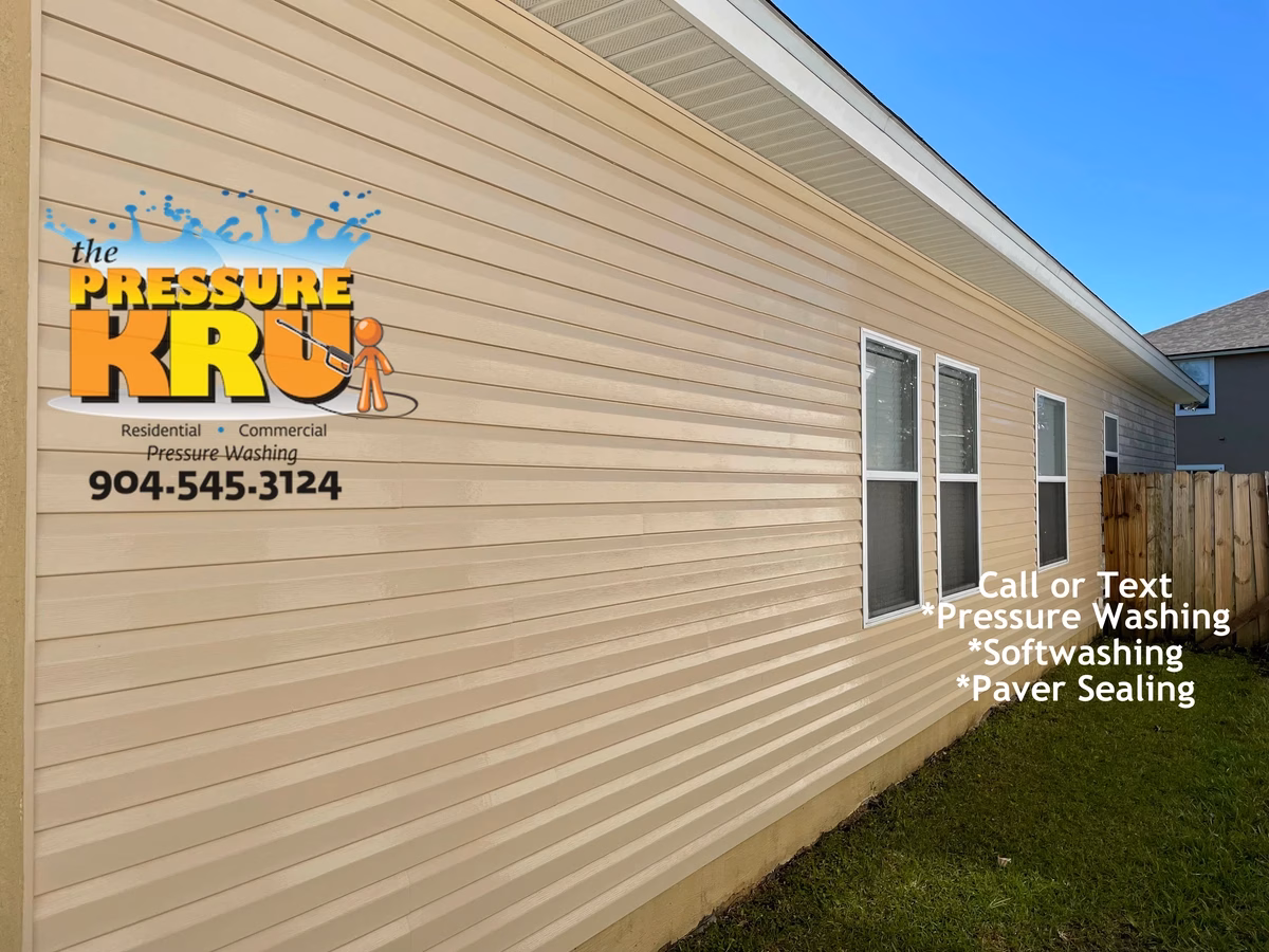 Professional vinyl siding house washing after soft washing in Julington Creek.