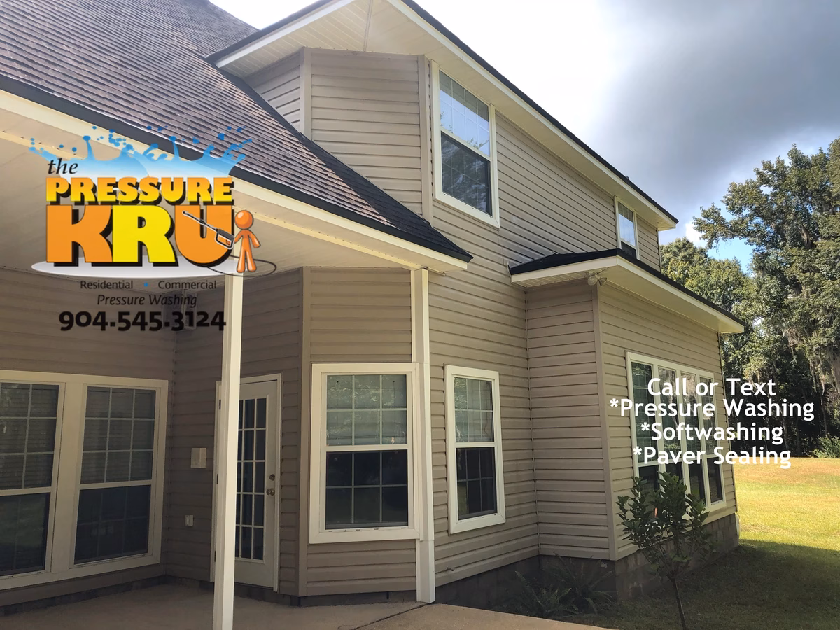 House washing after showing clean vinyl siding for home located in Durbin.