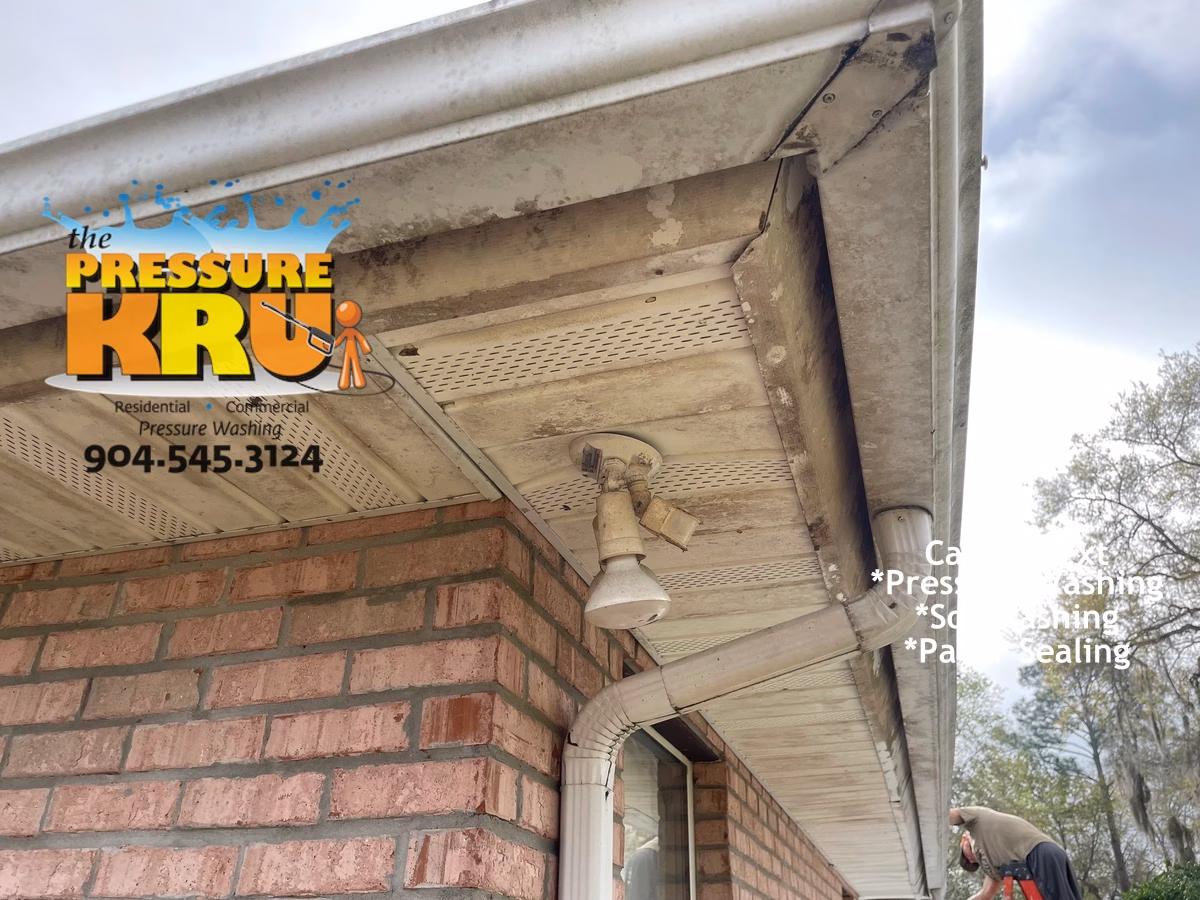 Brick home exterior siding and trim cleaning before professional soft washing in Fleming Island FL