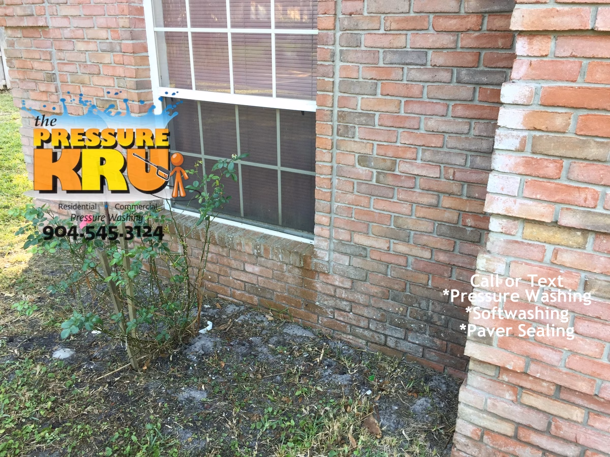 Before brick home exterior cleaning in Jacksonville FL removing years of grime
