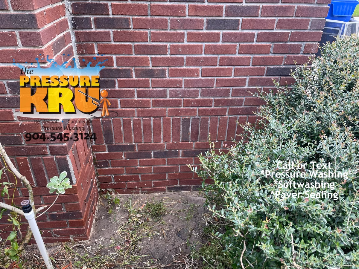 Before brick home exterior cleaning in Jacksonville FL siding restored