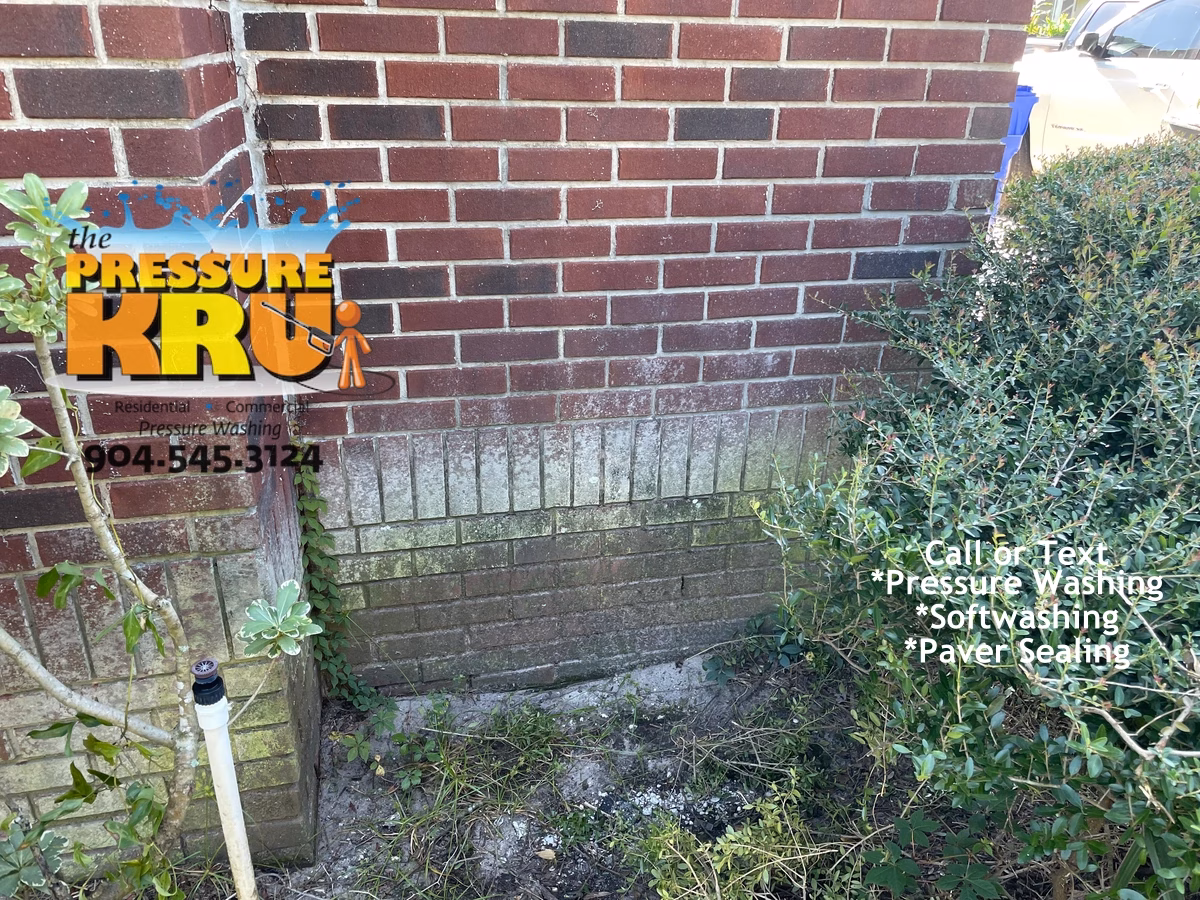 Before brick home exterior cleaning in Jacksonville FL removing years of grime