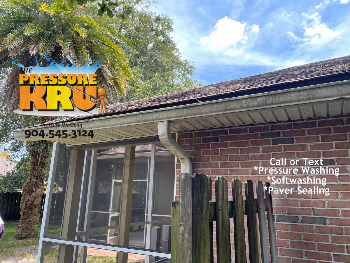 Brick house exterior soft washing service showing mold and mildew on gutter, siding and trim before cleaning in St Johns FL