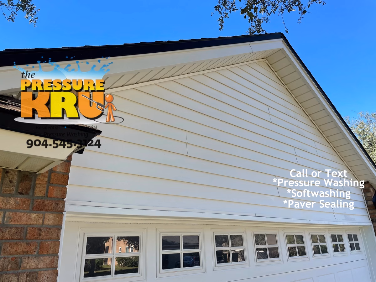 Brick Home with Vinyl after exterior cleaning in Fruit Cove FL. Shows annual growth accumulation