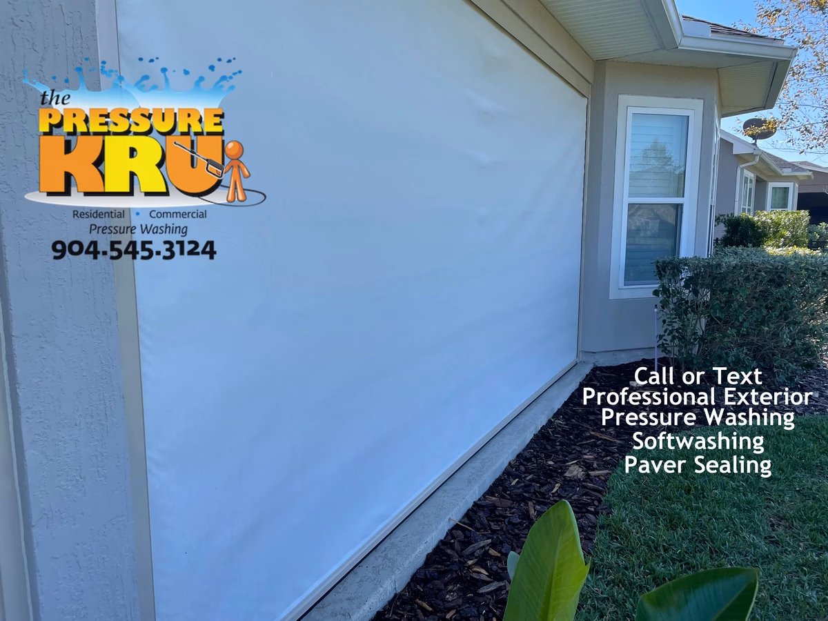 Motorized screen enclosure panels after professional cleaning in St Johns, FL by The Pressure Kru, Inc.