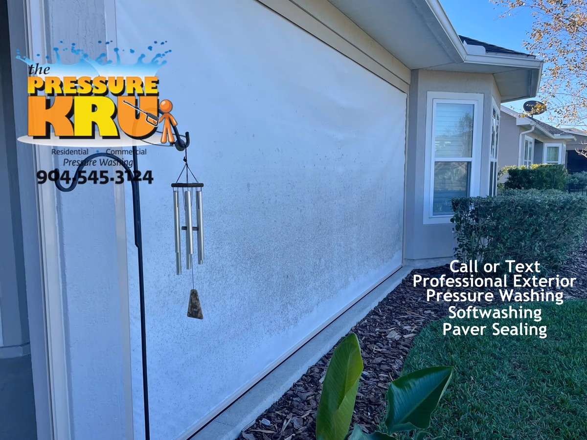 Motorized screen enclosure panels before professional cleaning in St Johns, FL by The Pressure Kru, Inc.