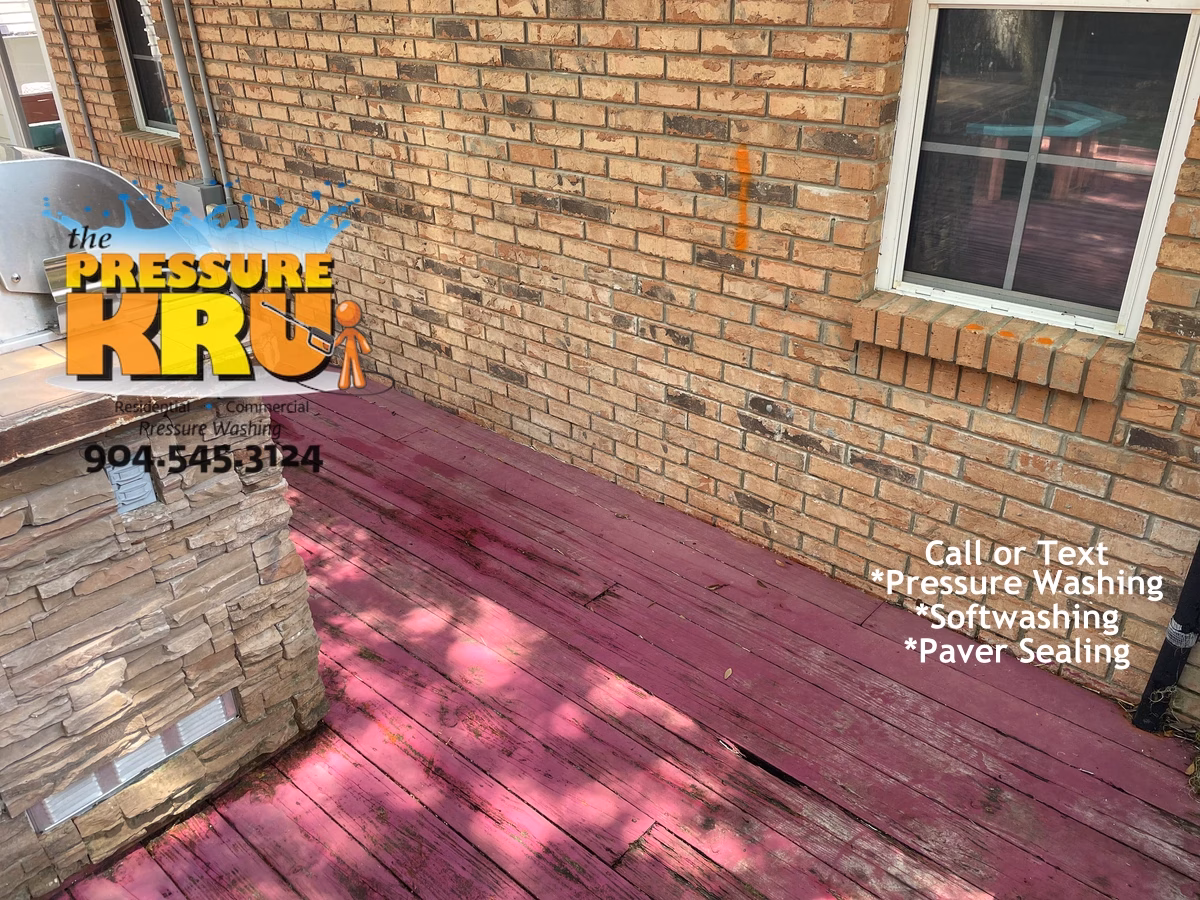 Brick exterior softwashing service completed on luxury home in Jacksonville FL with heavy green algae