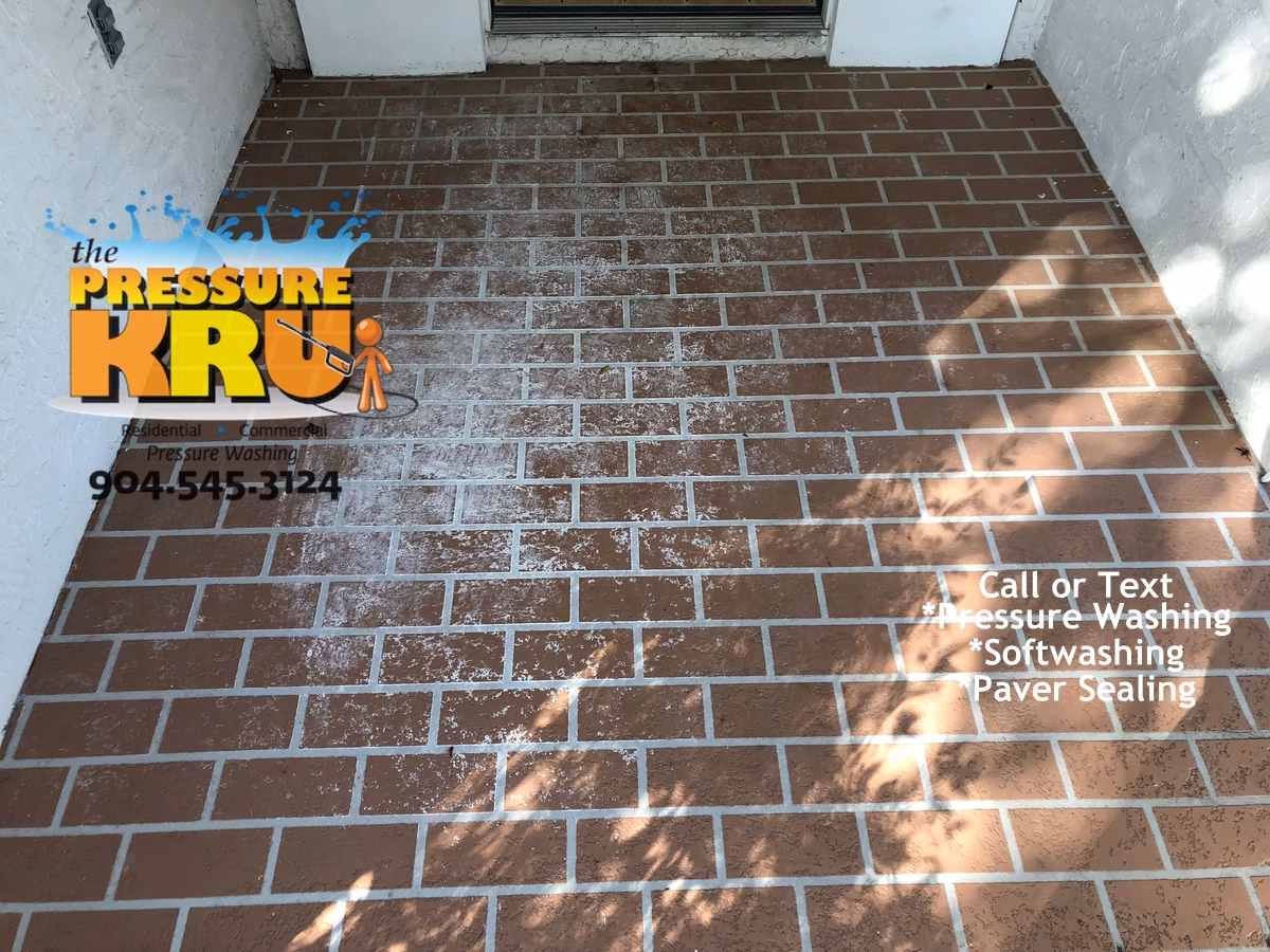 Professional brick exterior cleaning service showing dirt removal in Jacksonville FL