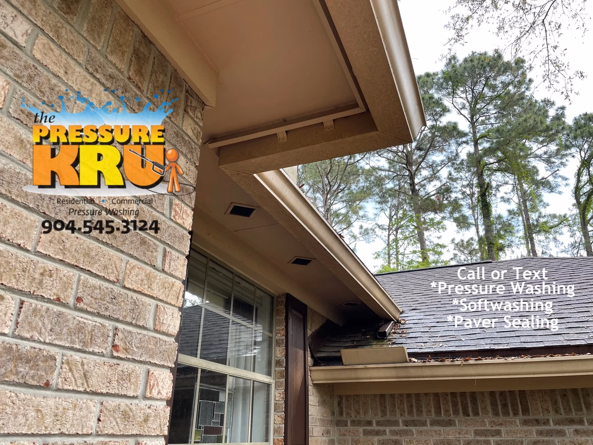 Brick home exterior cleaned by soft wash professional in Jacksonville FL before grime removal