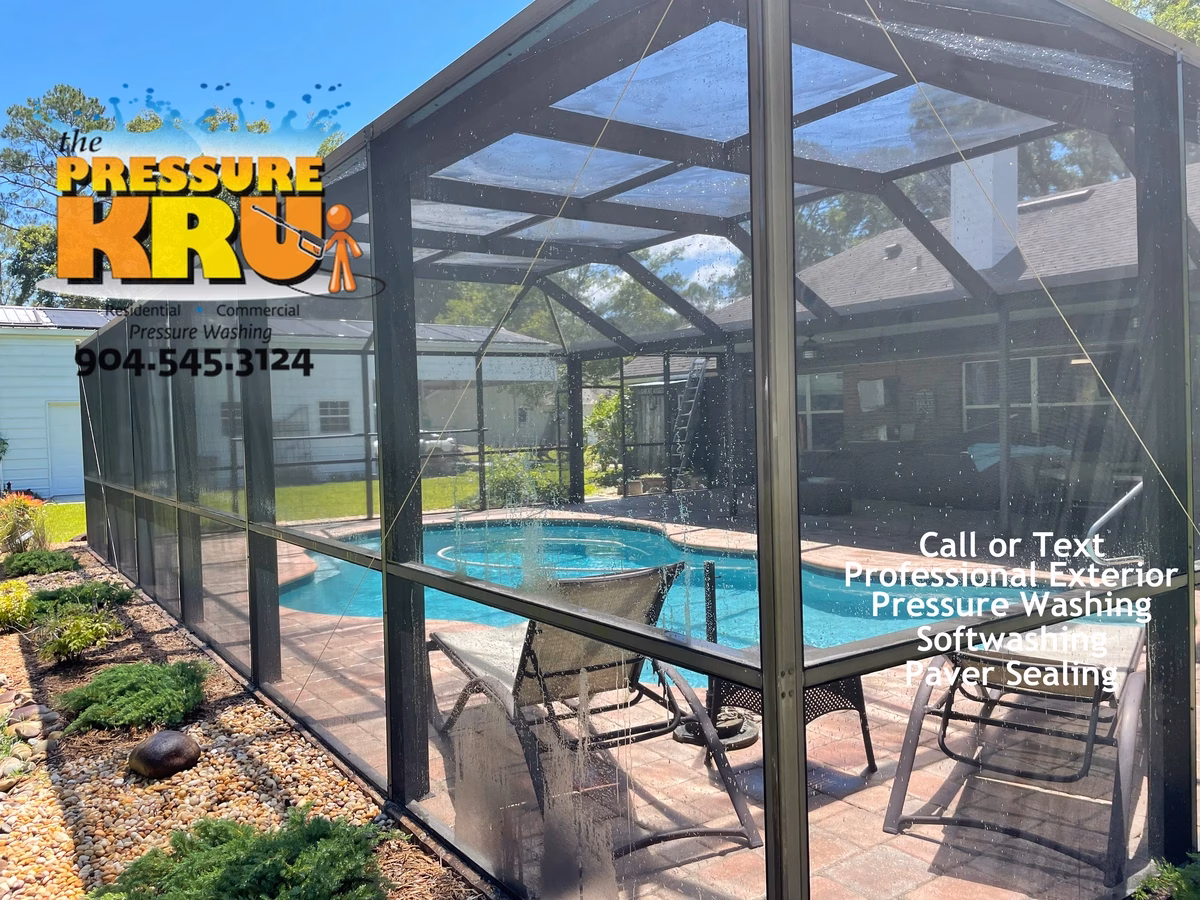 Pool cage enclosure after soft washing in Jacksonville, FL with spotless aluminum framing and clean screens.