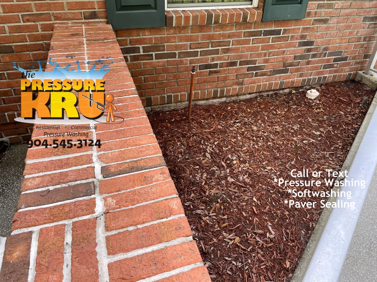 Brick home exterior after cleaning in St. Johns FL using a low-pressure cleaning system.