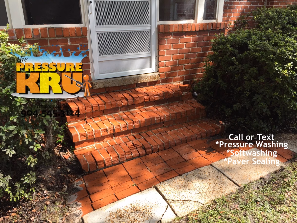 Brick home exterior softwashing after removing green algae, mold, and moss from entrance steps in Jacksonville FL