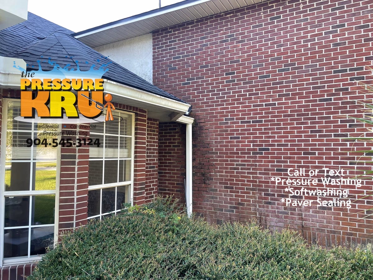 Brick home exterior safely cleaned with low-pressure soft washing in St Augustine FL before