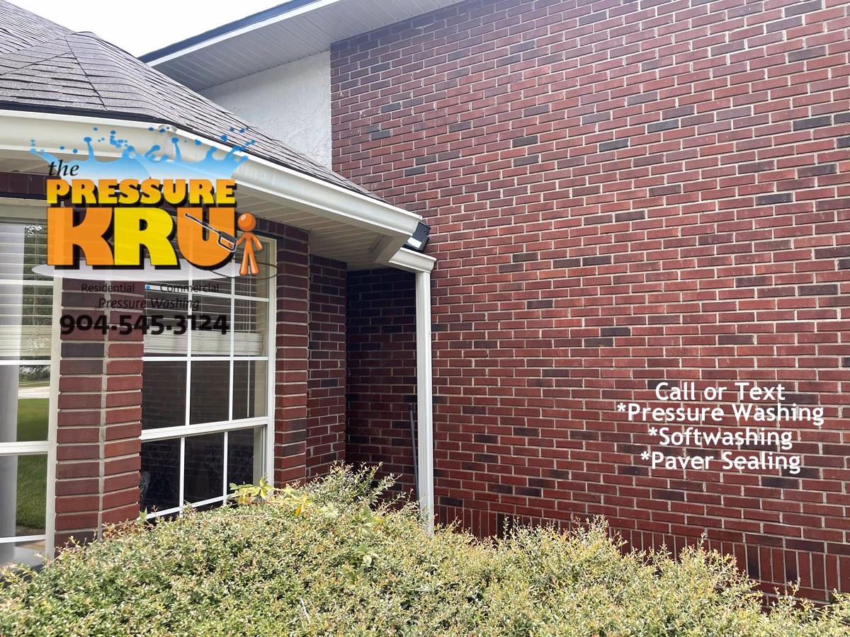 Brick home exterior safely cleaned with low-pressure soft washing in St Augustine FL after