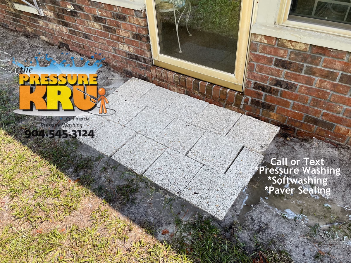 Brick home after exterior soft washing in St Augustine FL showing a crispy clean home thanks to The Pressure Kru