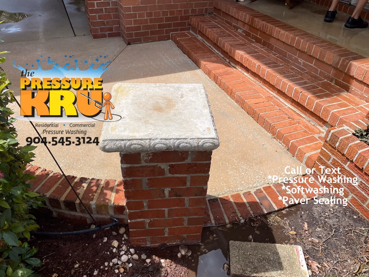 Brick house washing after professional softwashing in St Augustine FL with clean restored brick exterior