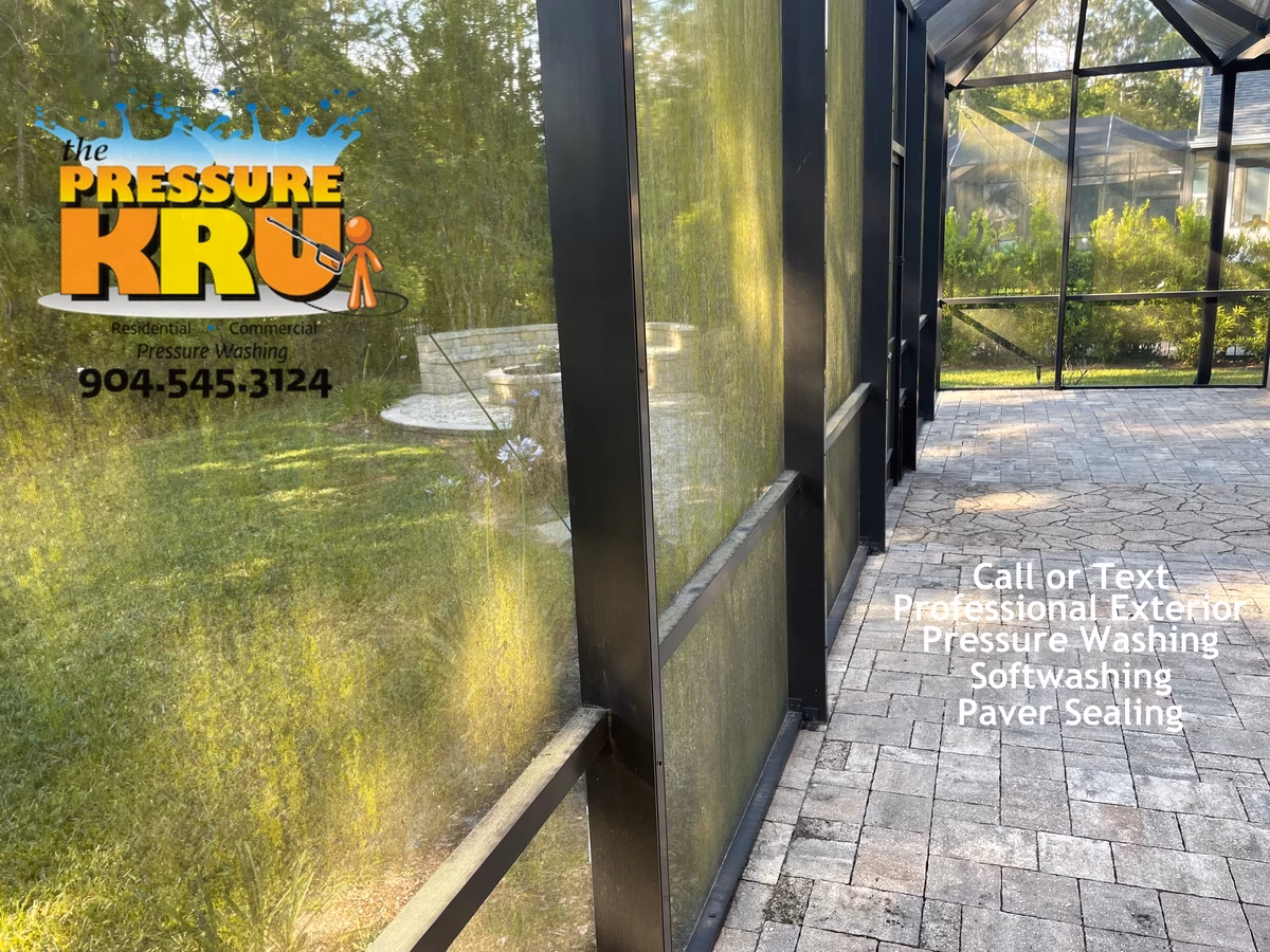 Residential pool screen enclosure before pressure washing services in St. Johns Forest.