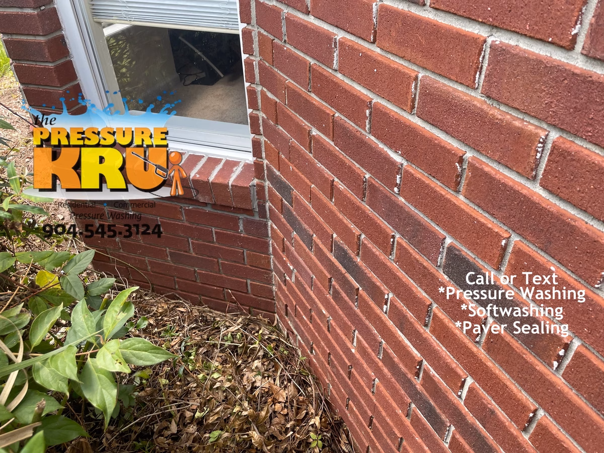 Brick house after professional soft washing in St. Johns FL with clean restored brick exterior