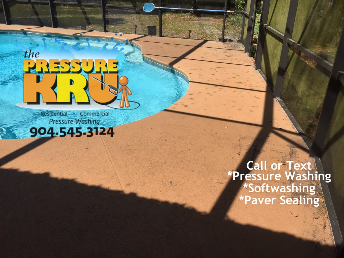Soft washing painted pool deck and screen enclosure in St Johns Golf and Country Club before