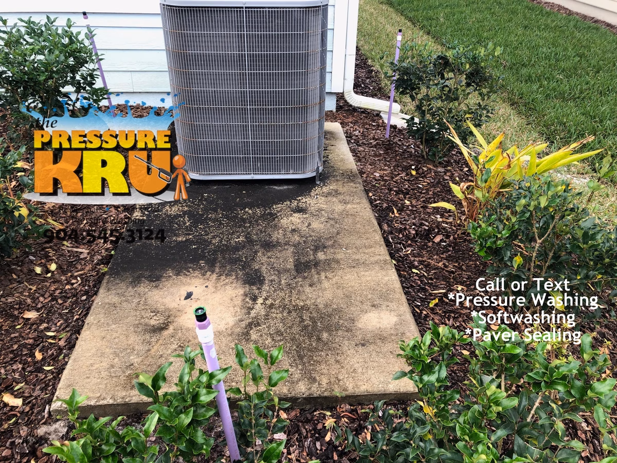 Professional concrete cleaning and restoration for house keeping pad in St. Johns, FL. Before cleaning.