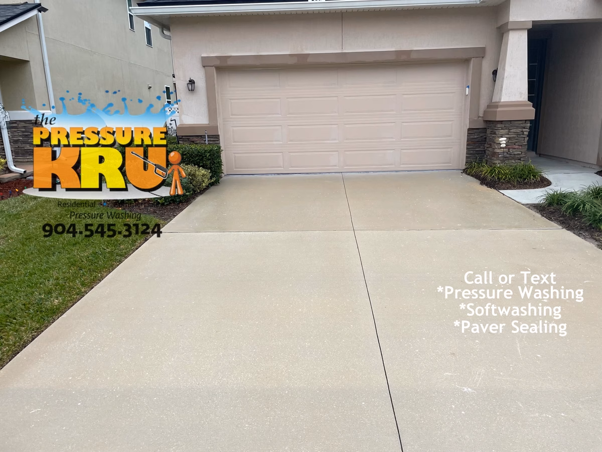 Clean white concrete driveway after professional pressure washing service near St. Johns, FL.