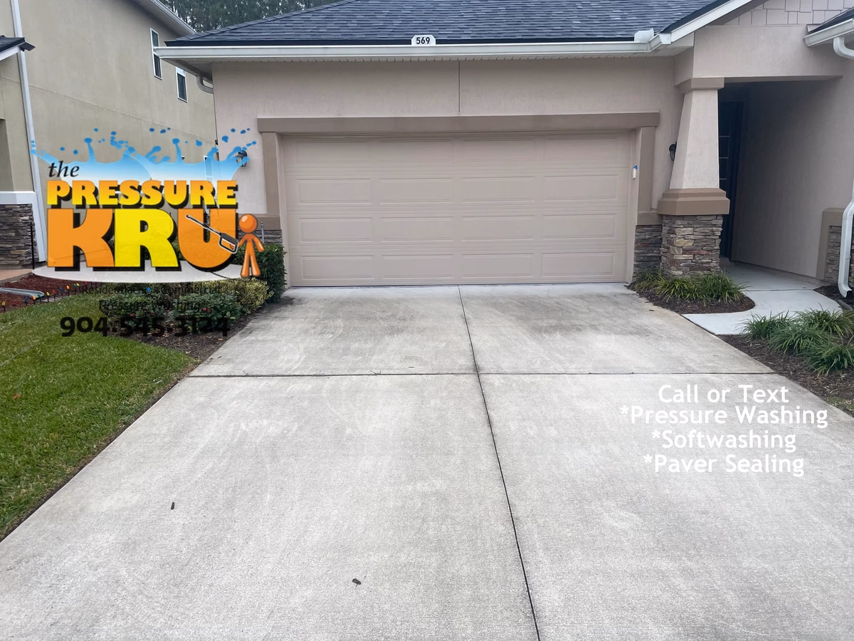 Clean white concrete driveway before professional pressure washing service near St. Johns, FL.