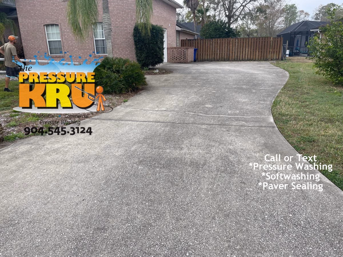 Heavy duty pressure cleaning of stained concrete driveway near St. Johns, FL. Before cleaning.
