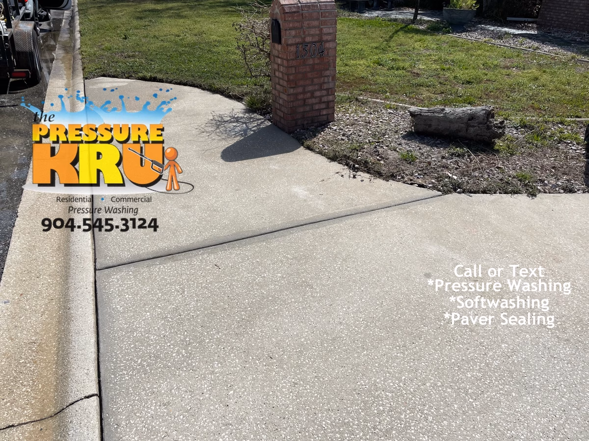 Local driveway cleaning company restoring curb appeal with soft washing technique in St. Johns, FL. After picture.