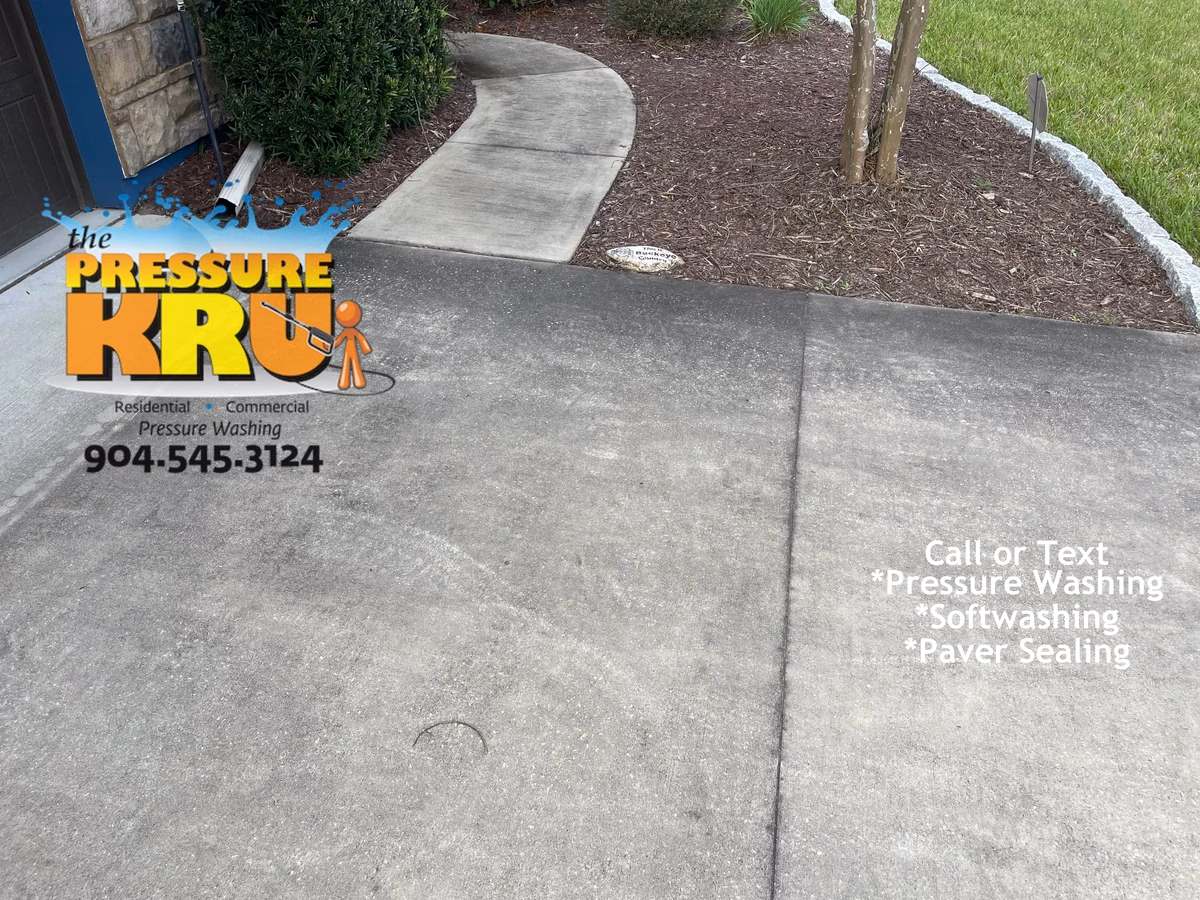 Spotless driveway entrance welcoming guest in St. Johns, FL. Before picture.