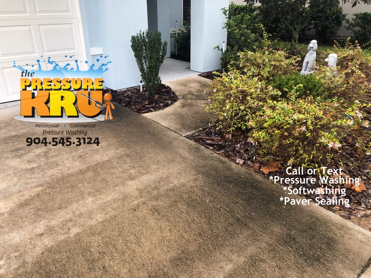 Maintaining property value with regular driveway care in St. Augustine, FL 32095. Before picture.