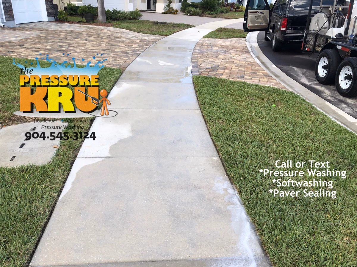 Restored sidewalk and driveway looking brand new after expert service in St. Augustine, FL. After picture.