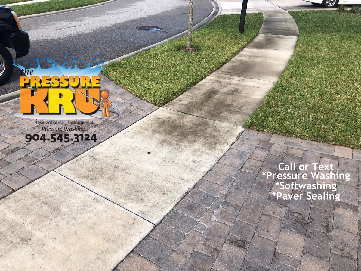 Thorough cleaning around garage doors and walkways in St. Johns, FL 32259. Before picture.