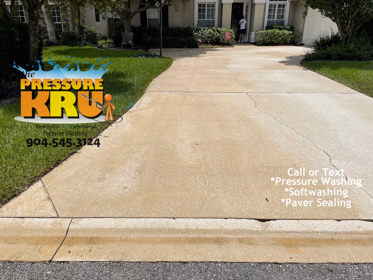 Gentle yet effective cleaning for concrete driveway in St. Augustine, FL after completing work.