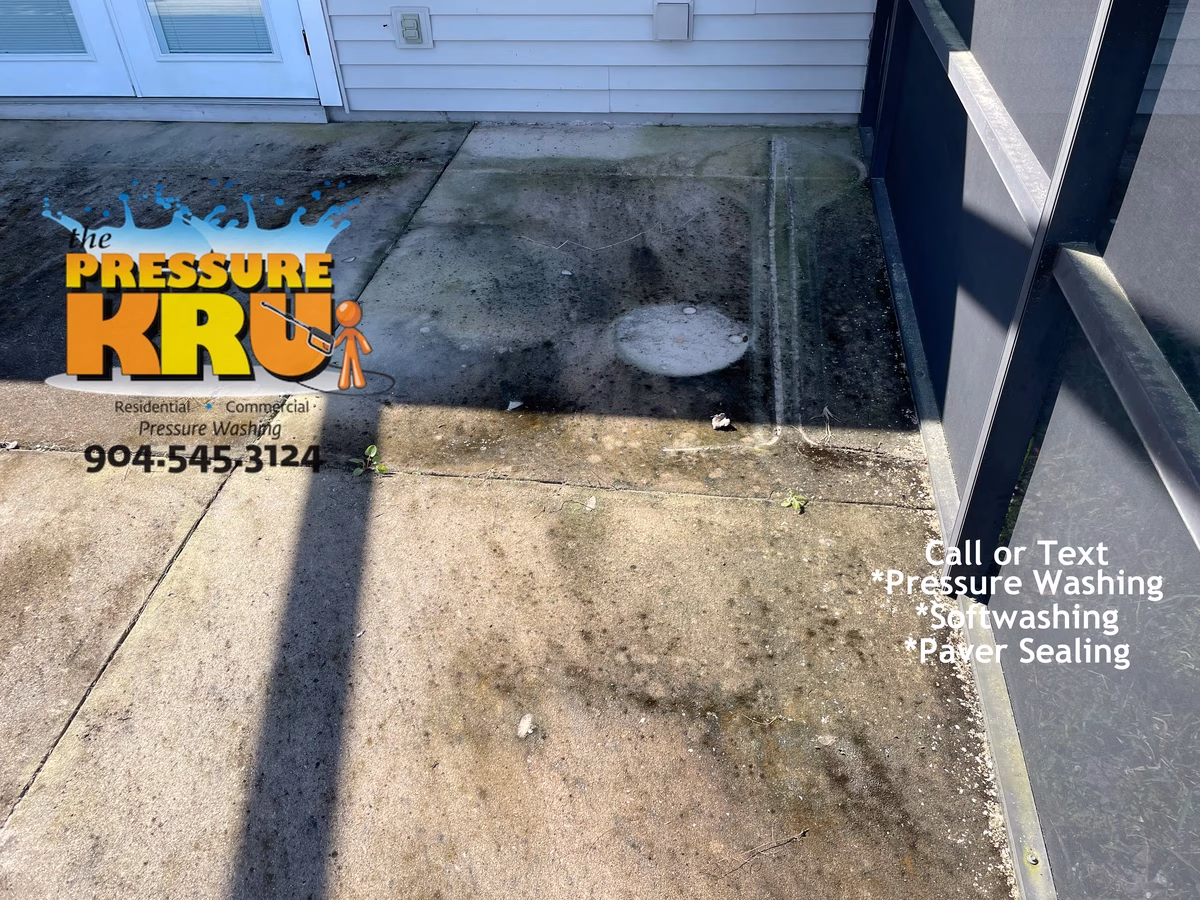 Before dirty patio concrete pressure washing in Jacksonville, Florida near Mandarin.