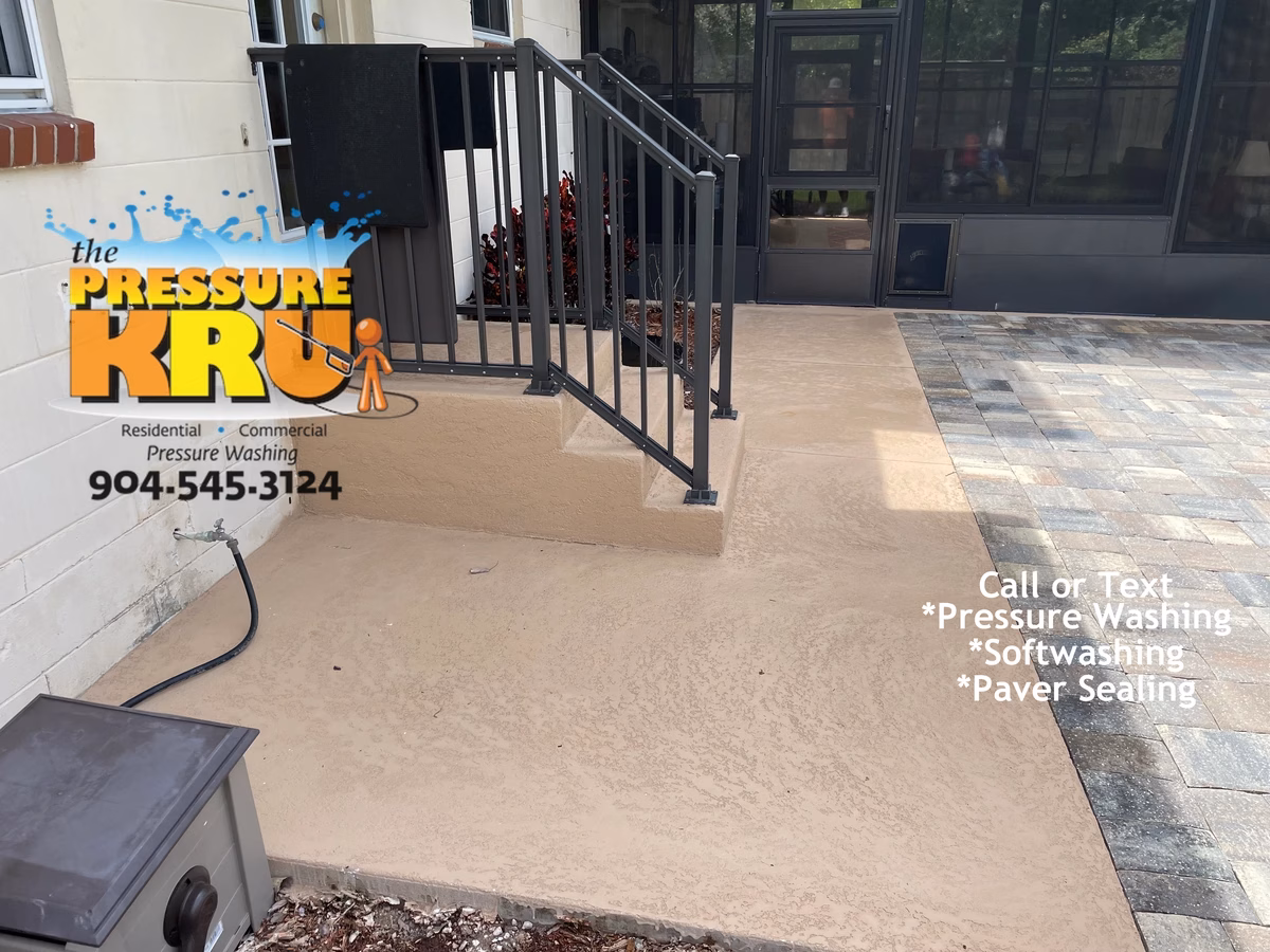 Painted concrete patio cleaning in Deerwood removing algae and mold after