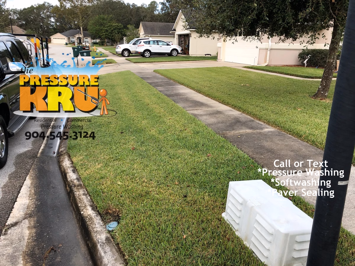 Detail power washing of concrete driveway and curb surfaces in St. Augustine, FL. Offered rust removal from curbing but owner declined. Could have completely removed this rust. Before image.