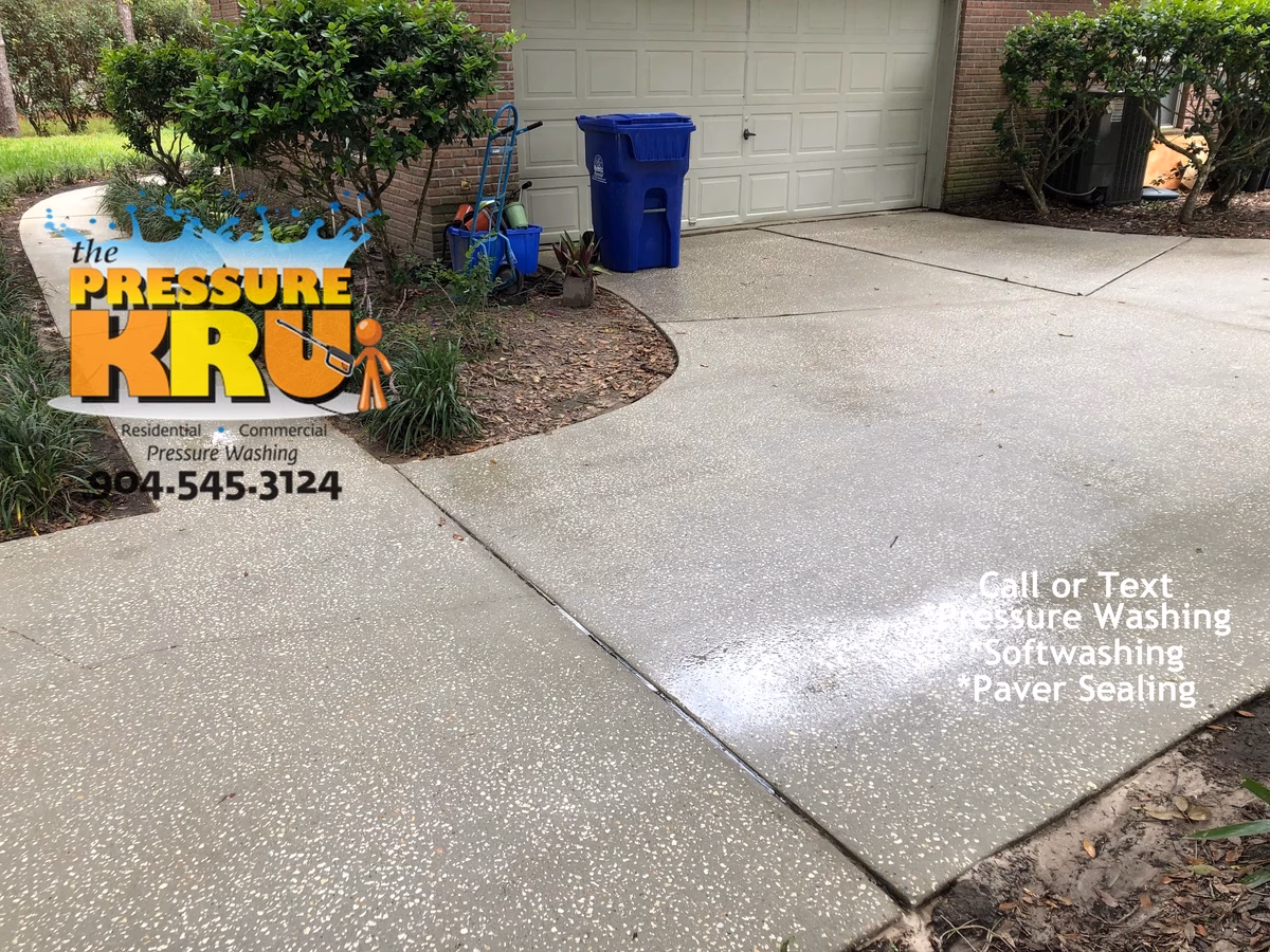 Expert team pressure washing residential driveway year-round near Windsor Park in Jacksonville, FL. After cleaning service.