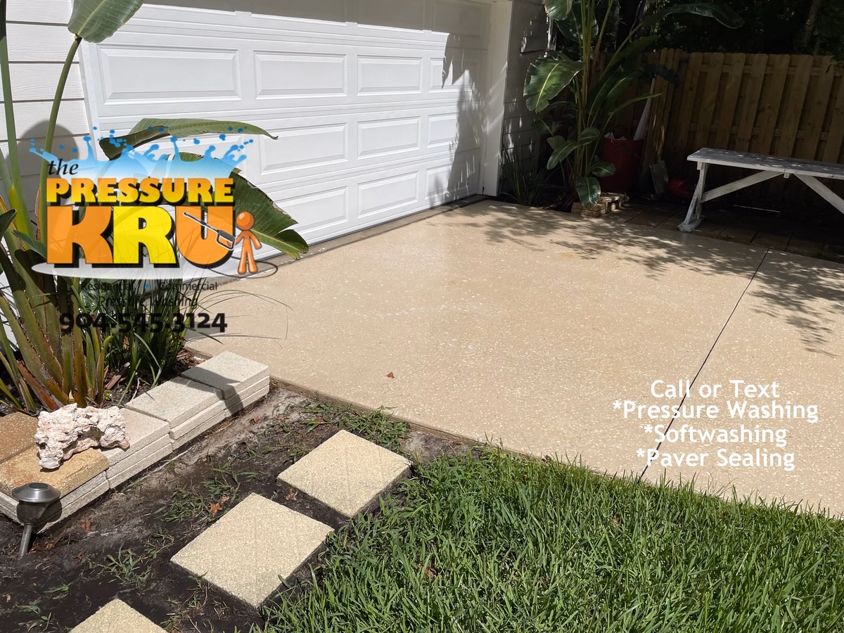 Removing black mold and mildew from driveway with hot water pressure in Jacksonville, FL. This image show after cleaning.