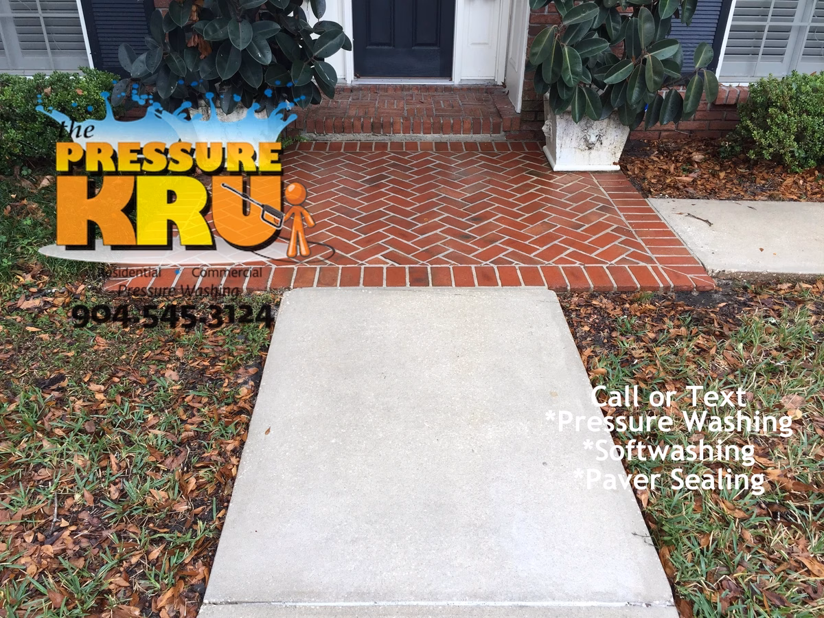 Before and after gallery of local driveway pressure washing projects in St. Johns County. After soft washing application.