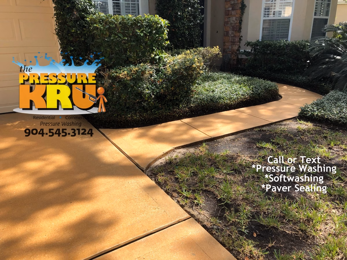 Professional concrete driveway after cleaning boosting property value in St Johns, FL.