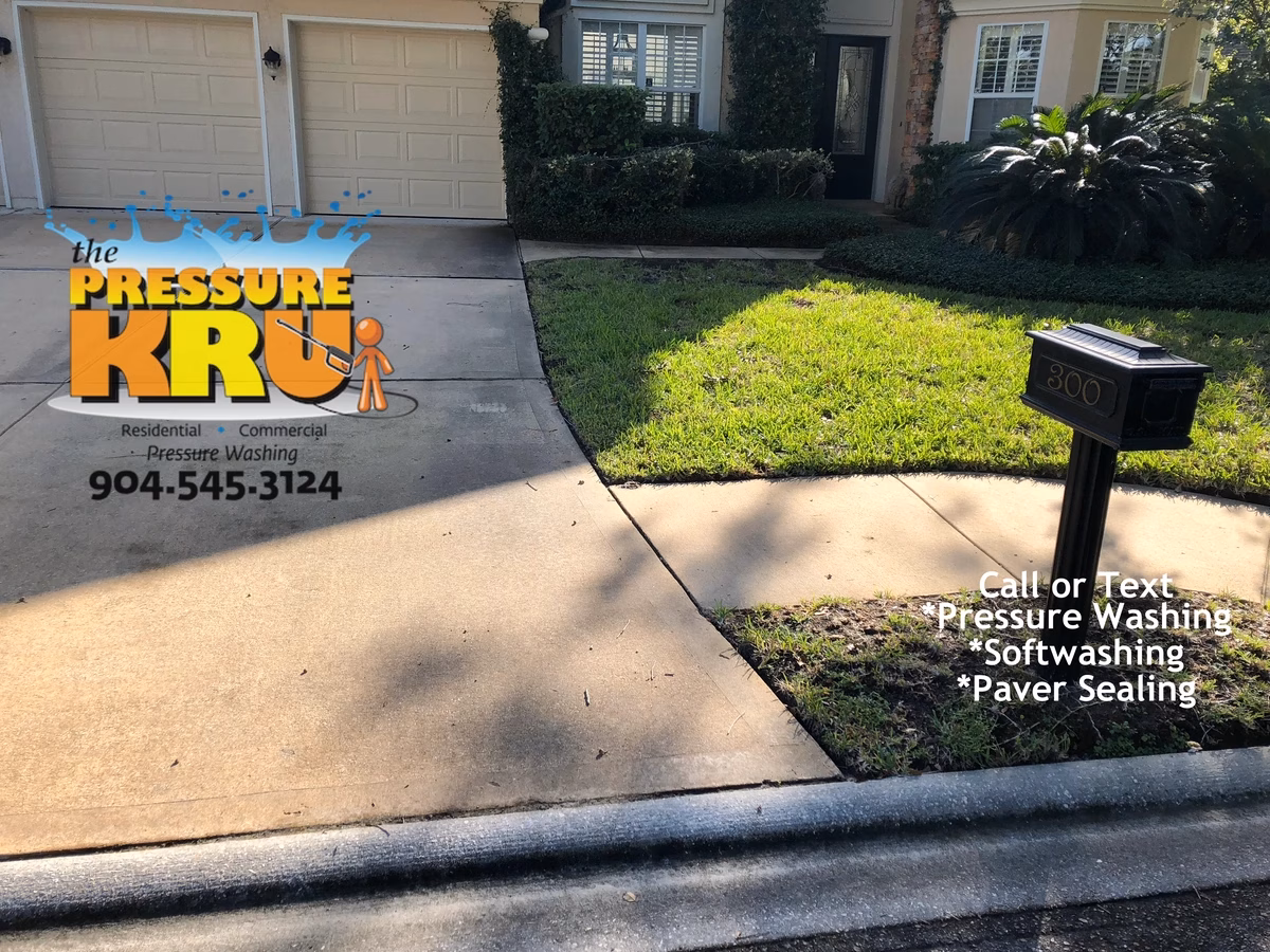 Power washing large two-car driveway in suburban St Johns County before starting work.