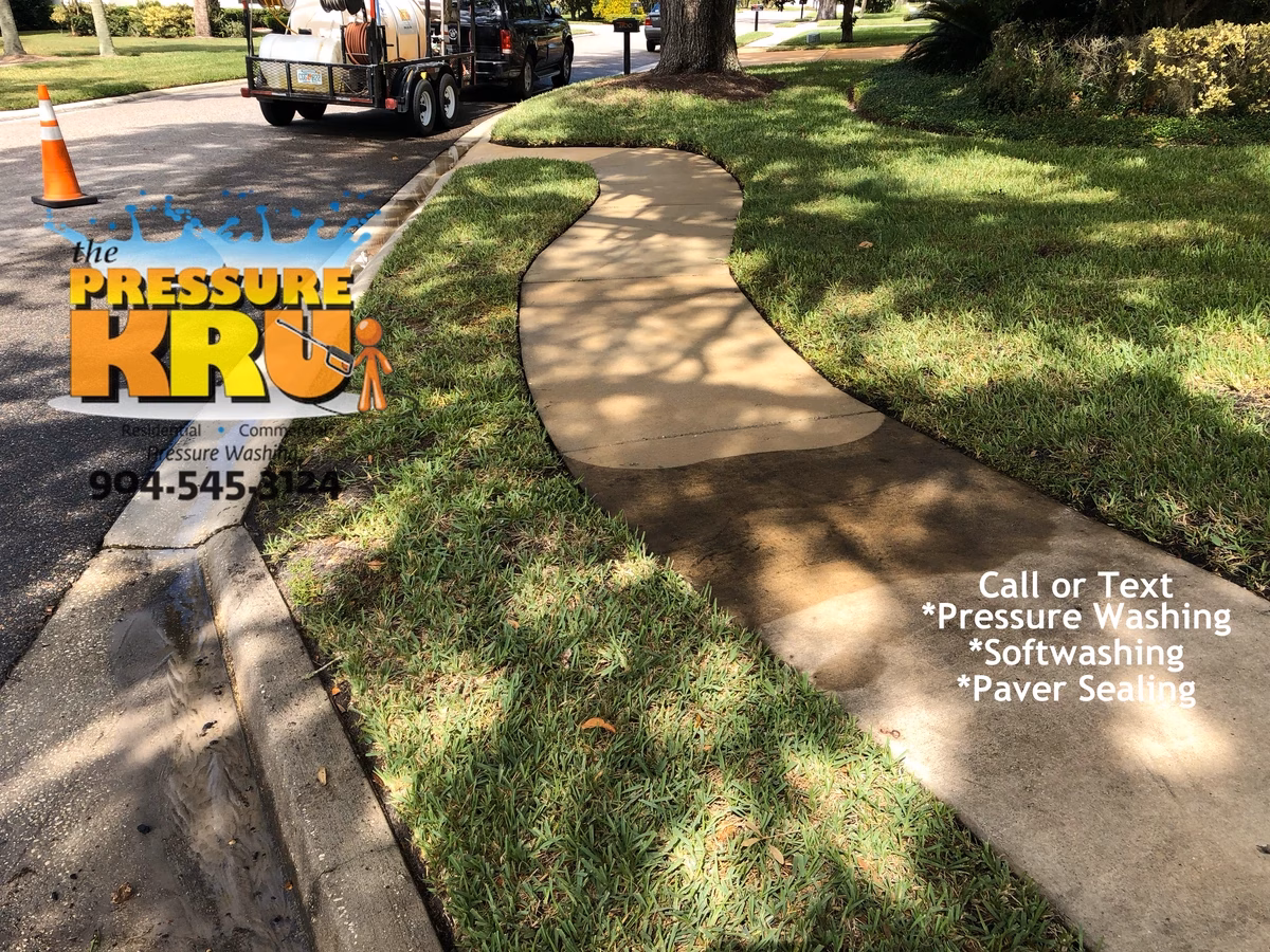 Spotless sidewalks and driveway after complete pressure cleaning and soft washing in St. Johns, FL.