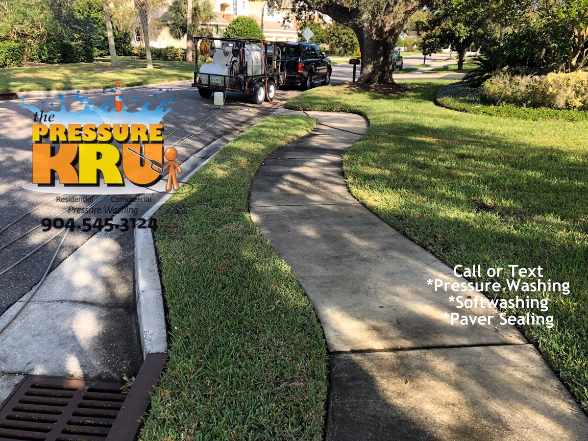 Spotless sidewalks and driveway before complete pressure cleaning and soft washing in St. Johns, FL.