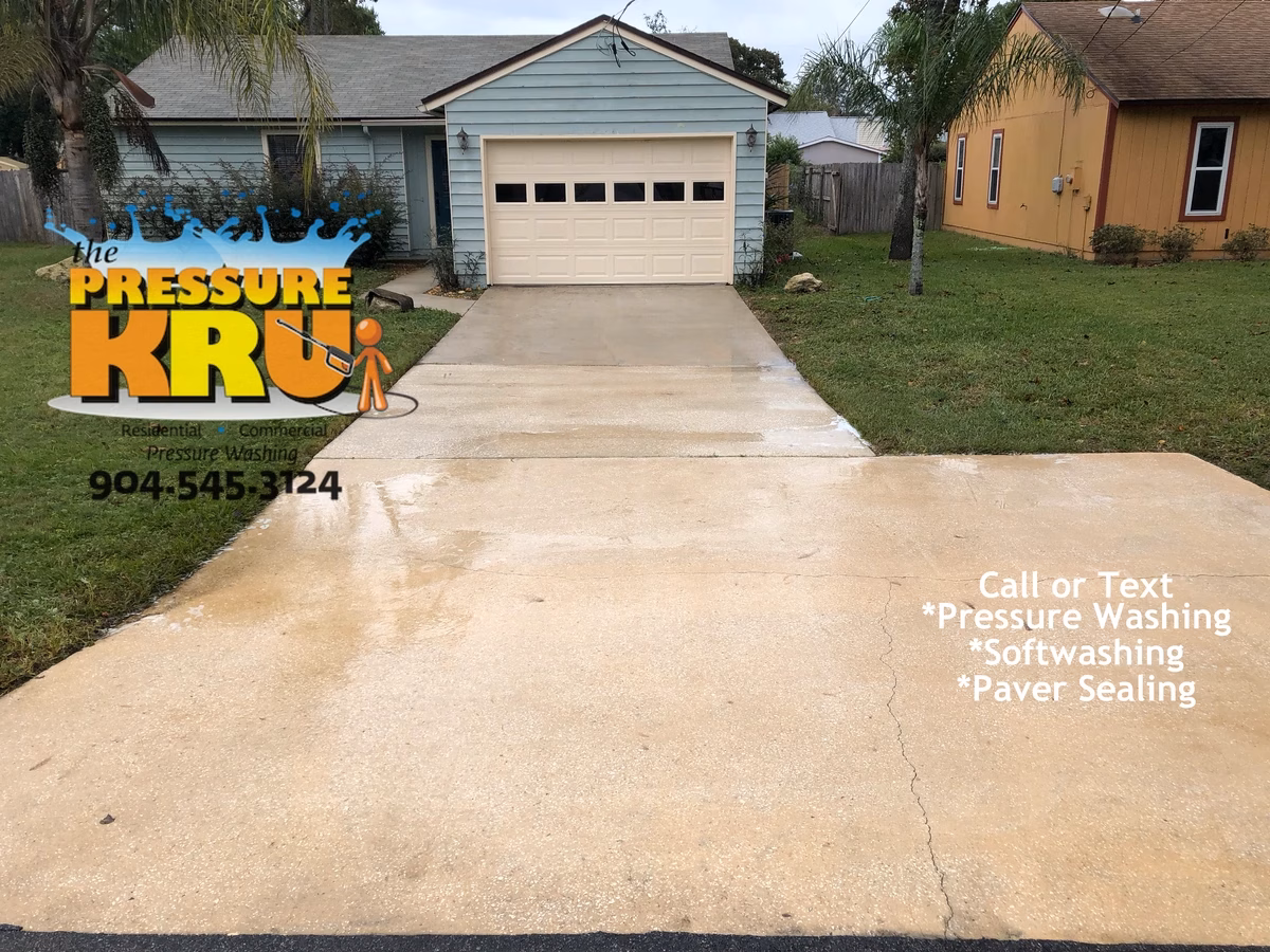 Beautifully cleaned non-draining concrete driveway in St Johns FL. After finishing this was horrible draining situation.