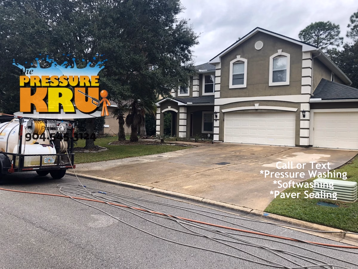 Rust Stain removal from this concrete driveway using targeted pressure wash in St Johns FL before service.