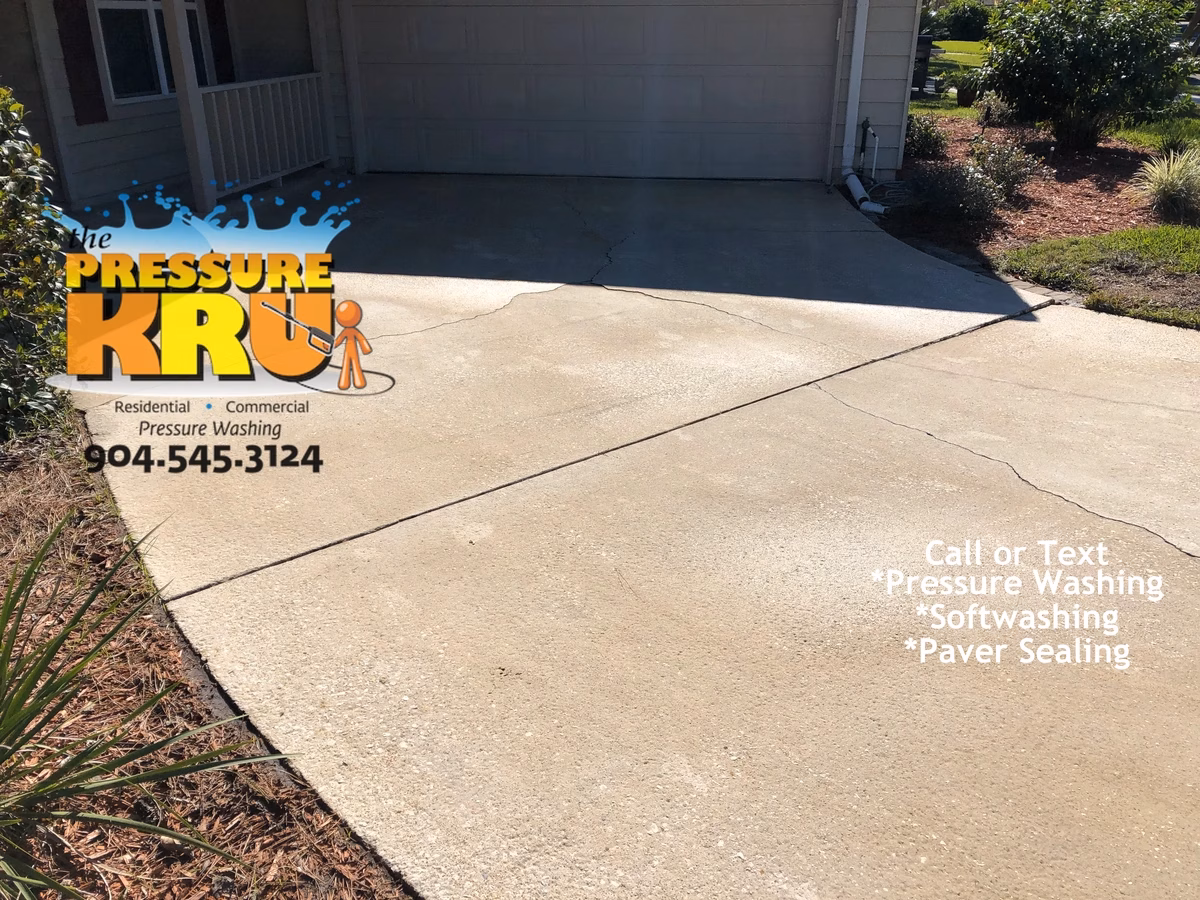 After photo of dirty driveway vs after professional cleaning in St. Johns, FL