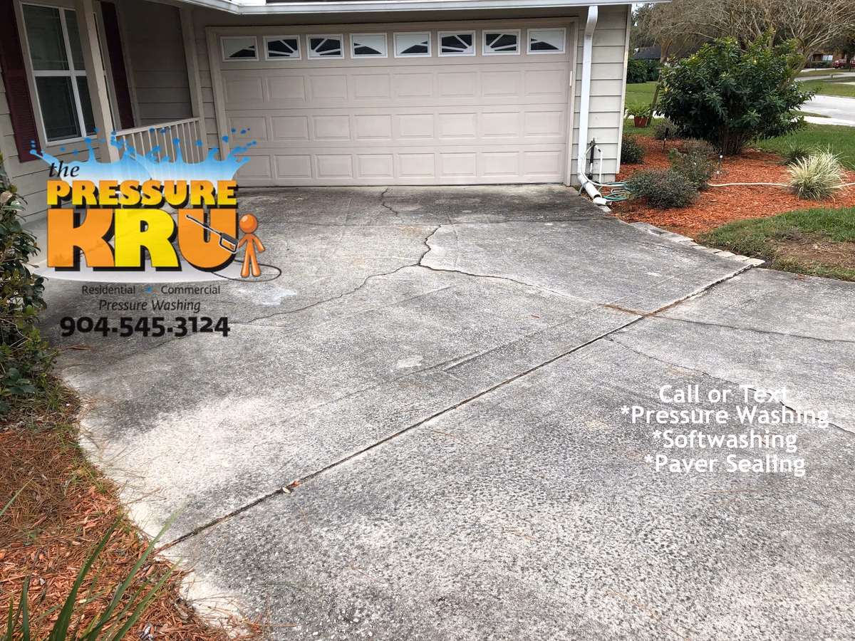 Before photo of dirty driveway vs after professional cleaning in St. Johns, FL